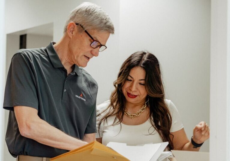 Nonprofit advisor reviewing financials with executive director